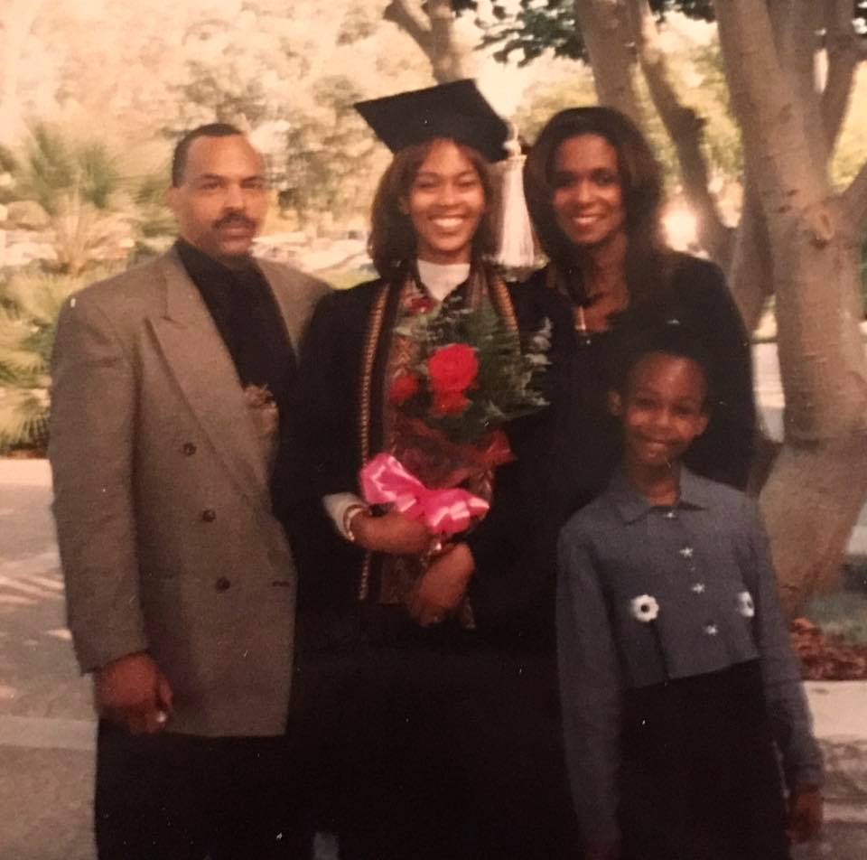 photo of Natasha with her parents and sister at Natasha's 1997 college graduation